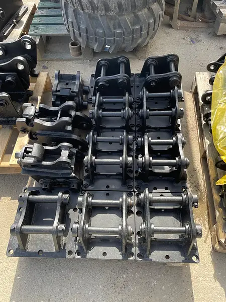 Quick couplers and supports for excavator attachments